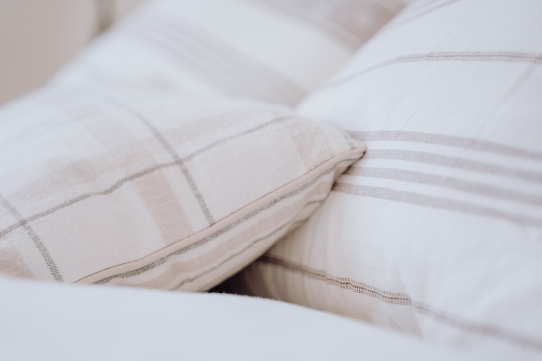 hero-img a-close-up-of-a-pillow-on-a-bed-x-svx96baea